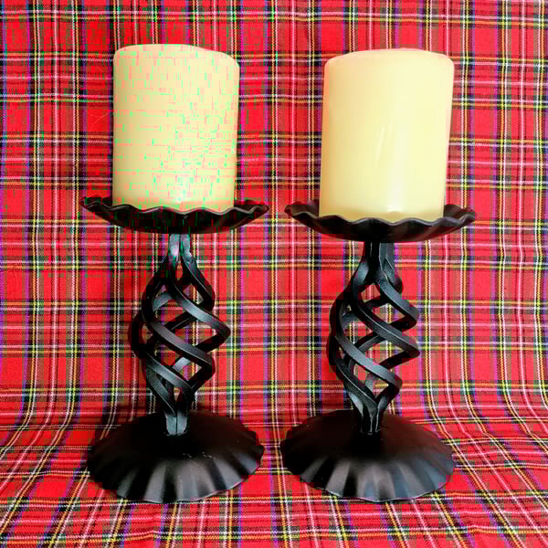 Pair of black blacksmith made candlesticks