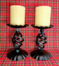 Pair of black blacksmith made candlesticks