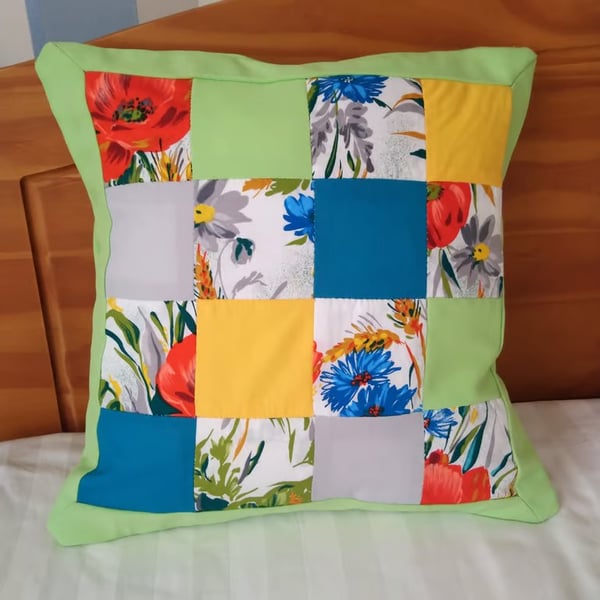 Patchwork cushion covers in lime green, turquoise, yellow, grey and floral. Two.