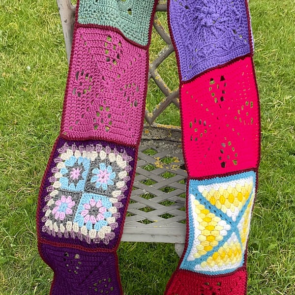 Crocheted long hippy style granny square scarf.