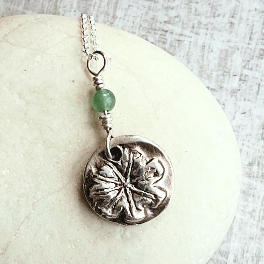 Botanical silver pendant with poppy seed head design and aventurine.