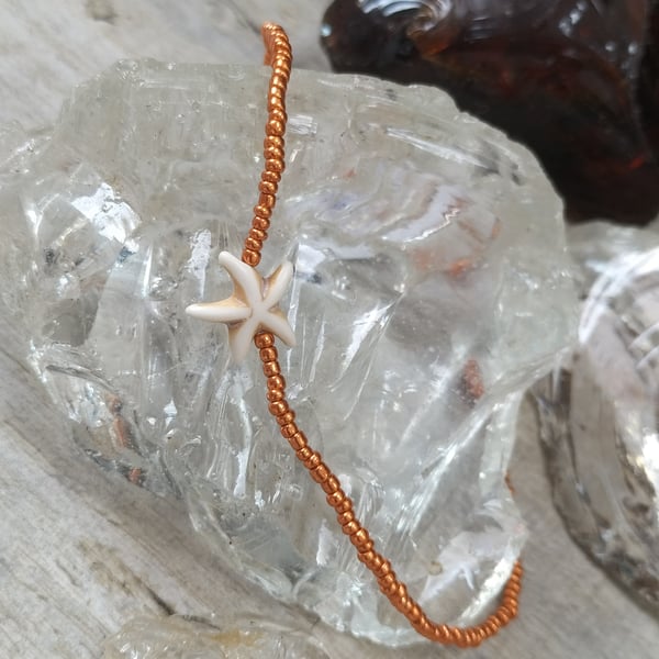 Orange beaded anklet with starfish