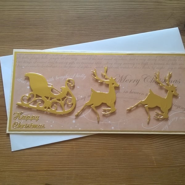 Gold Christmas reindeers with sled card