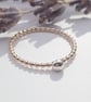 Skinny Gold Filled Ring with Sterling Silver Bead - Image 1
