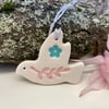 Teeny ceramic dove decoration with pink leaves and blue flower