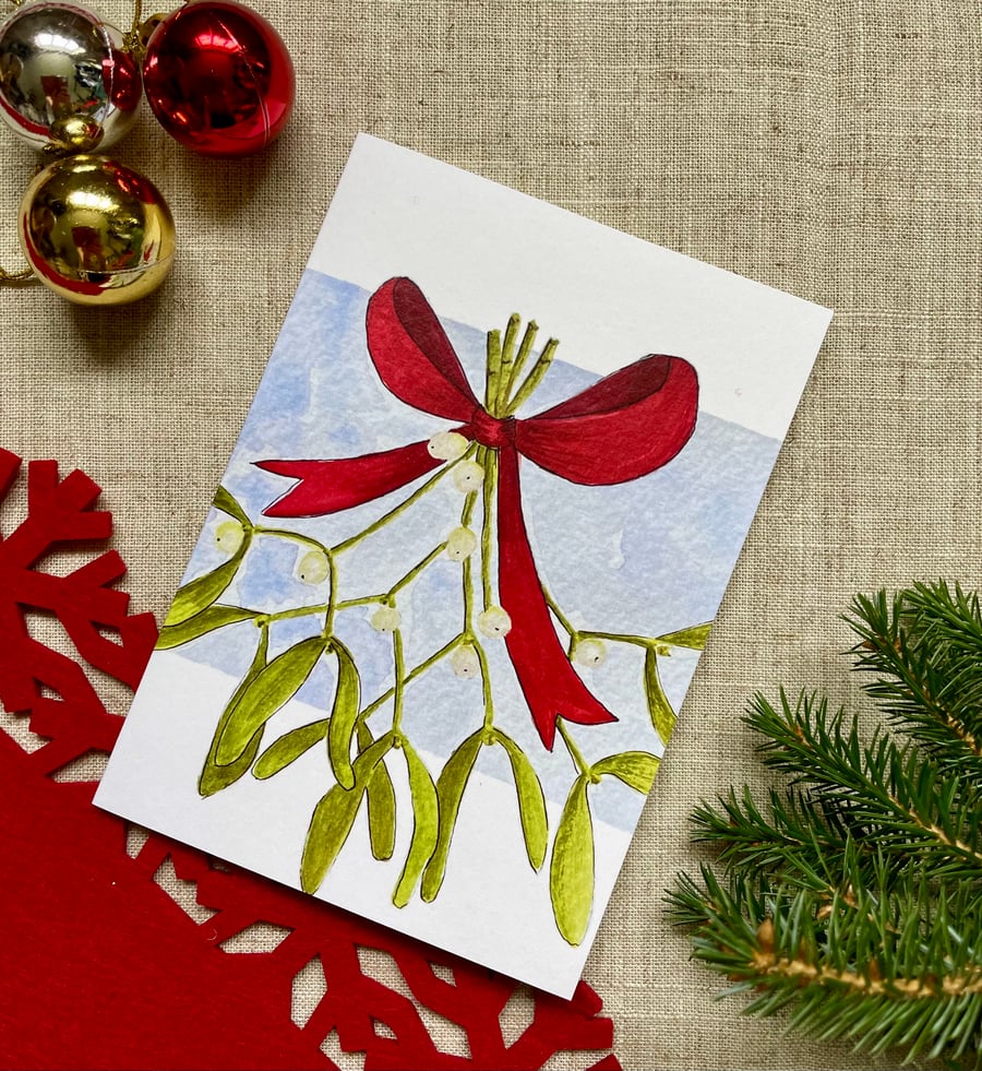 Card, Christmas card, bunch of mistletoe tied with red ribbon.