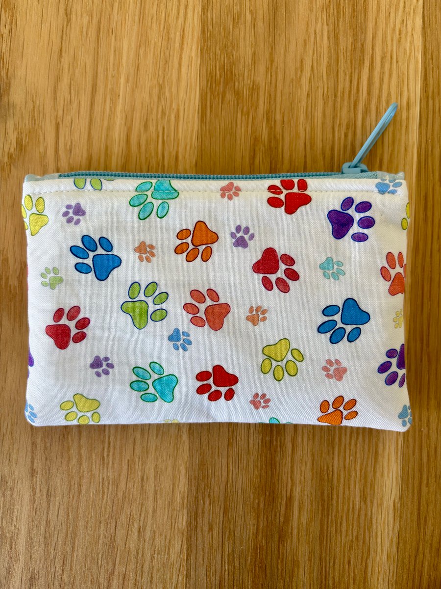 Small zipped fabric pouch, purse, make up bag, white with bright paw prints