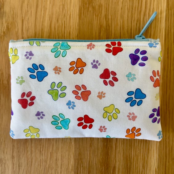 Small zipped fabric pouch, purse, make up bag, white with bright paw prints