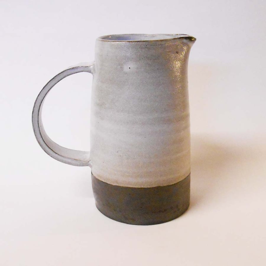 Jug Little Black rustic wheel thrown white glazed Tapered .