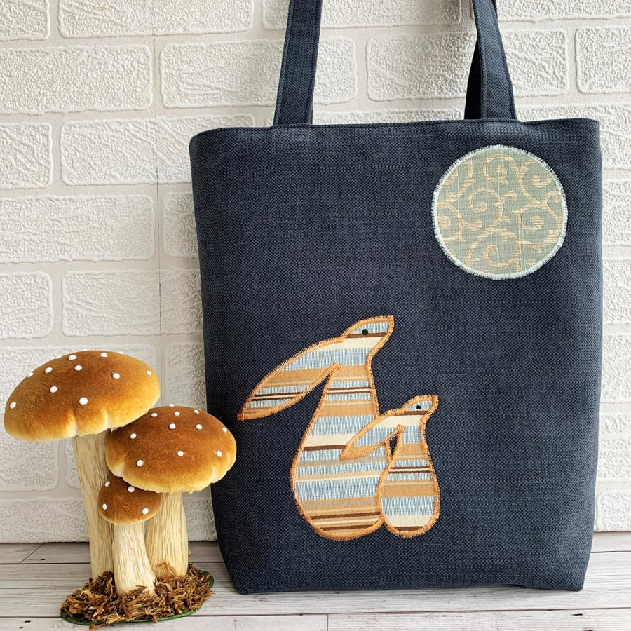 Navy blue tote bag with striped moon gazing hares
