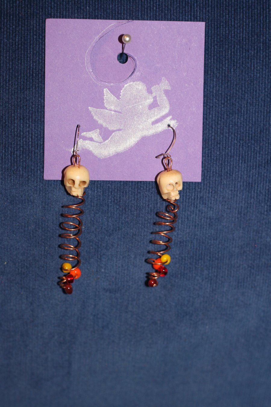 Spiral and skull earrings