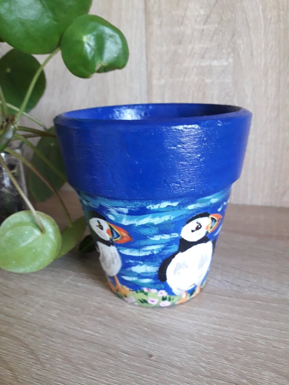 Re-purposed Terracotta plant pot handpainted with a pair of Puffins.  