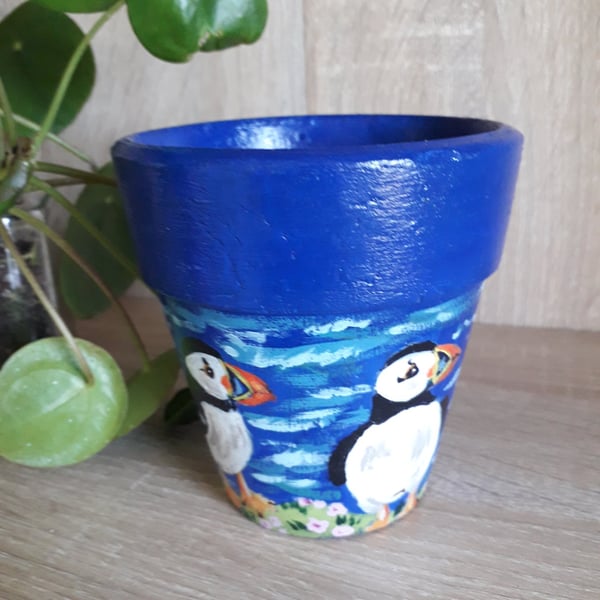 Re-purposed Terracotta plant pot handpainted with a pair of Puffins.  