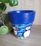 Re-purposed Terracotta plant pot handpainted with a pair of Puffins.  