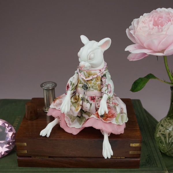 'Odile', a porcelain and textile mouse doll.