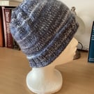WOMENS HAND KNITTED HAT IN MULTICOLOURED BLUE YARN APPROX 9" or 23cm LONG
