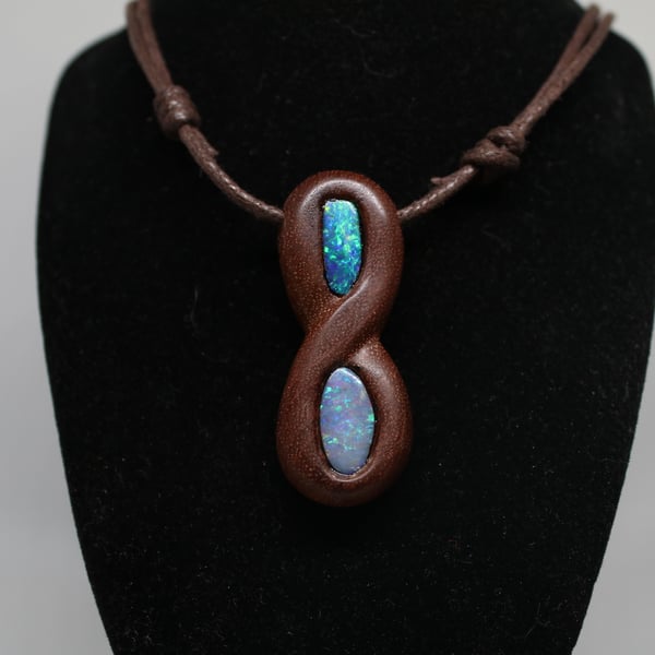 Opal infinity loop wooden pendant.