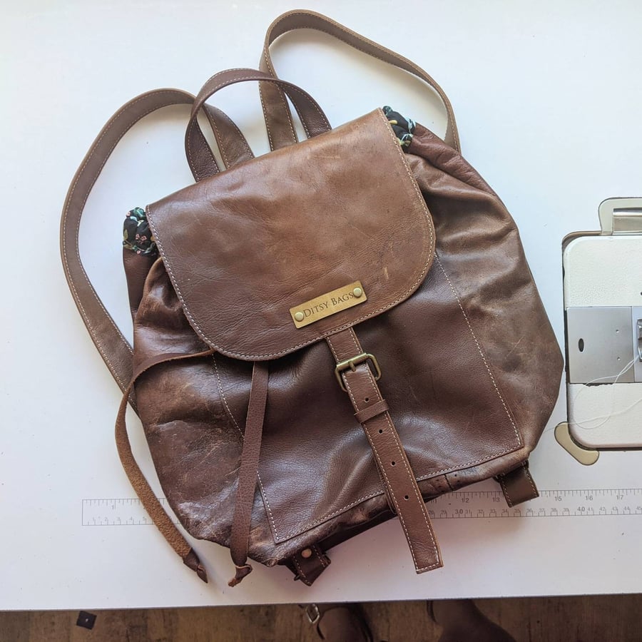 Small genuine leather backpack with pretty floral lining