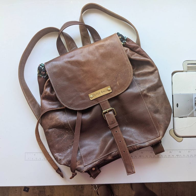 Small genuine leather backpack with pretty floral lining