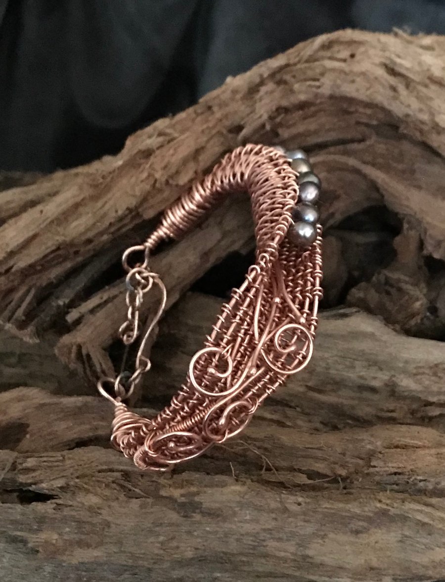 Copper wire wrapped freshwater pearl bracelet. 