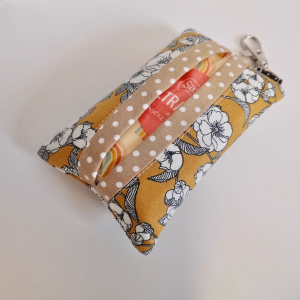 Key ring tissue tidy in mustard and black floral fabric with a useful clasp