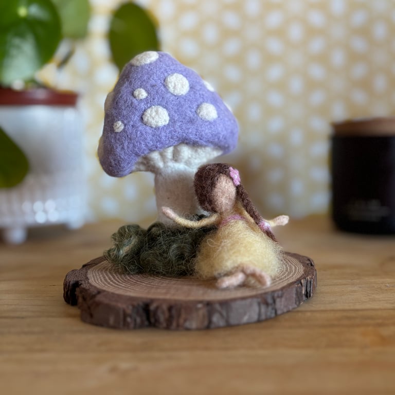 Needlefelted wool lilac toadstool and fairy dressed in yellow