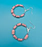 Hoop earrings threaded with dusky pink paper beads - Image 3