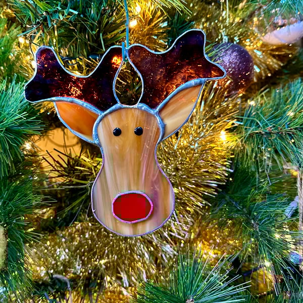 Stained glass reindeer suncatcher decoration in caramel with red nose