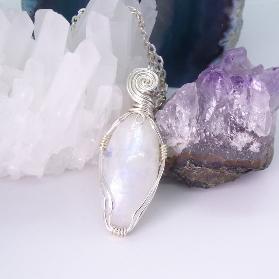 Rainbow moonstone pendant, wrapped in silver plated copper wire. 