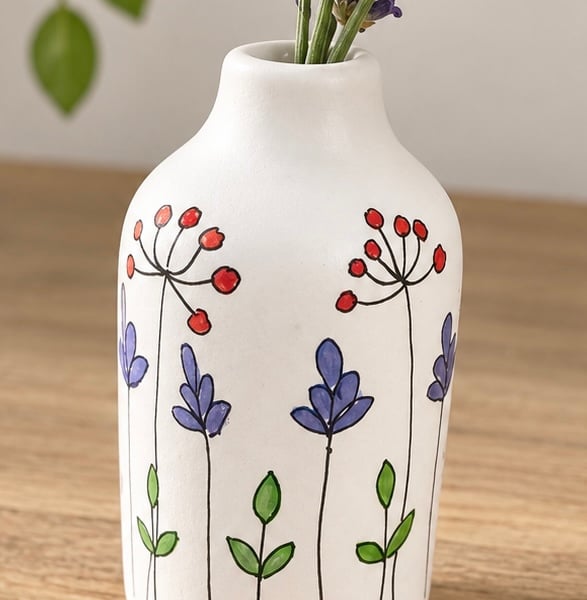 Mini ceramic vase with hand drawn flowers