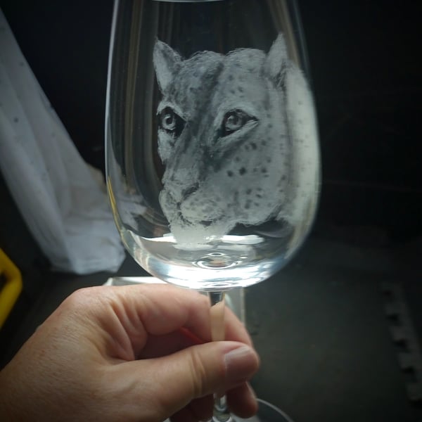 Leopard on a wineglass