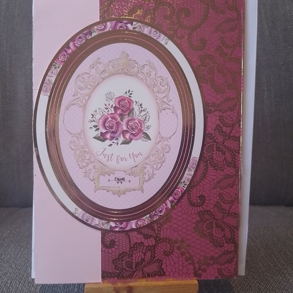 A pink  congratulatins card