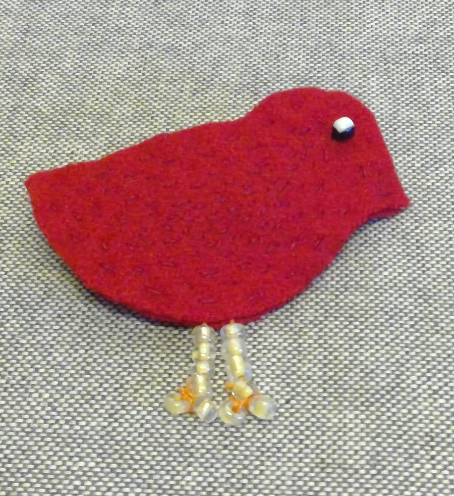 Red bird brooch with bead legs