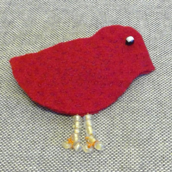 Red bird brooch with bead legs