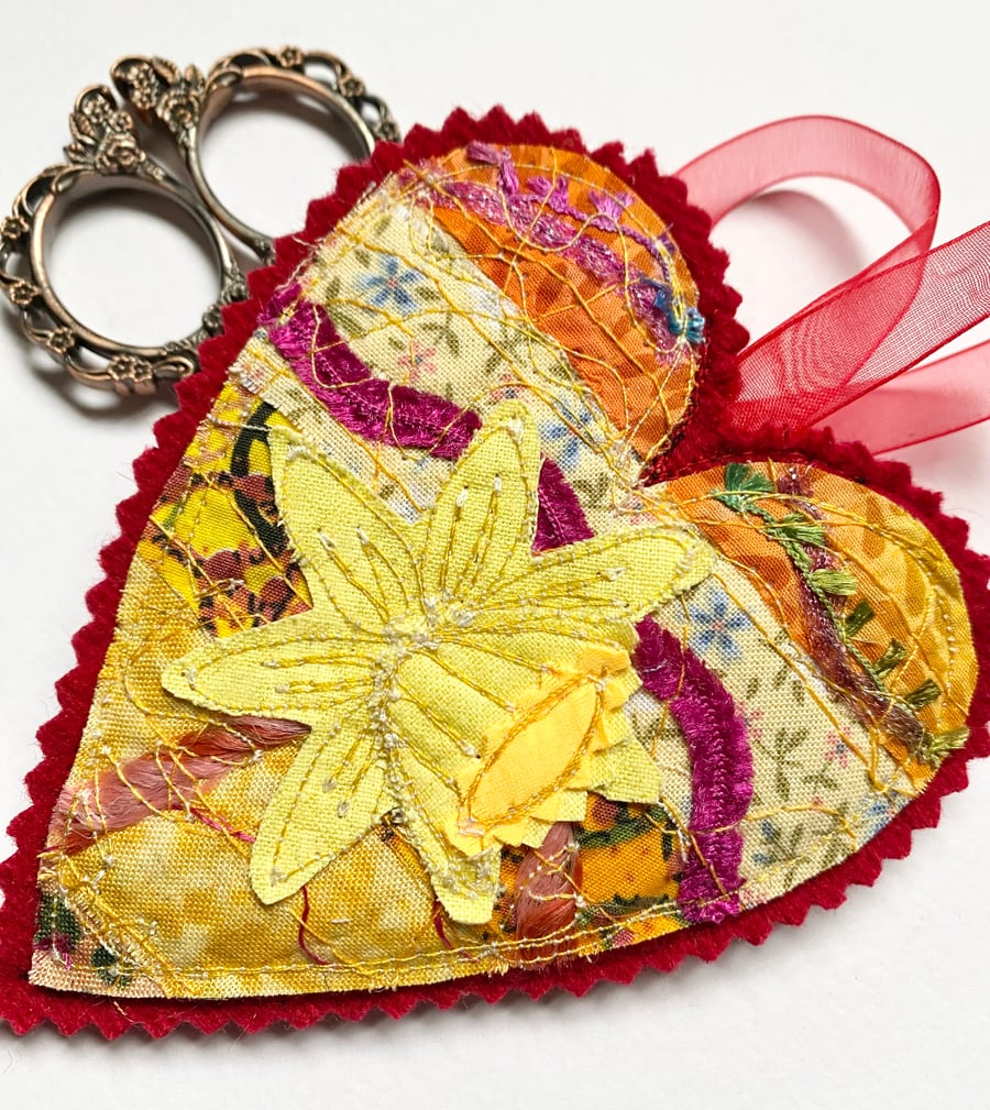 Upcycled daffodil and heart spring embroidered home decoration.