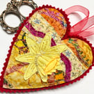 Upcycled daffodil and heart spring embroidered home decoration.