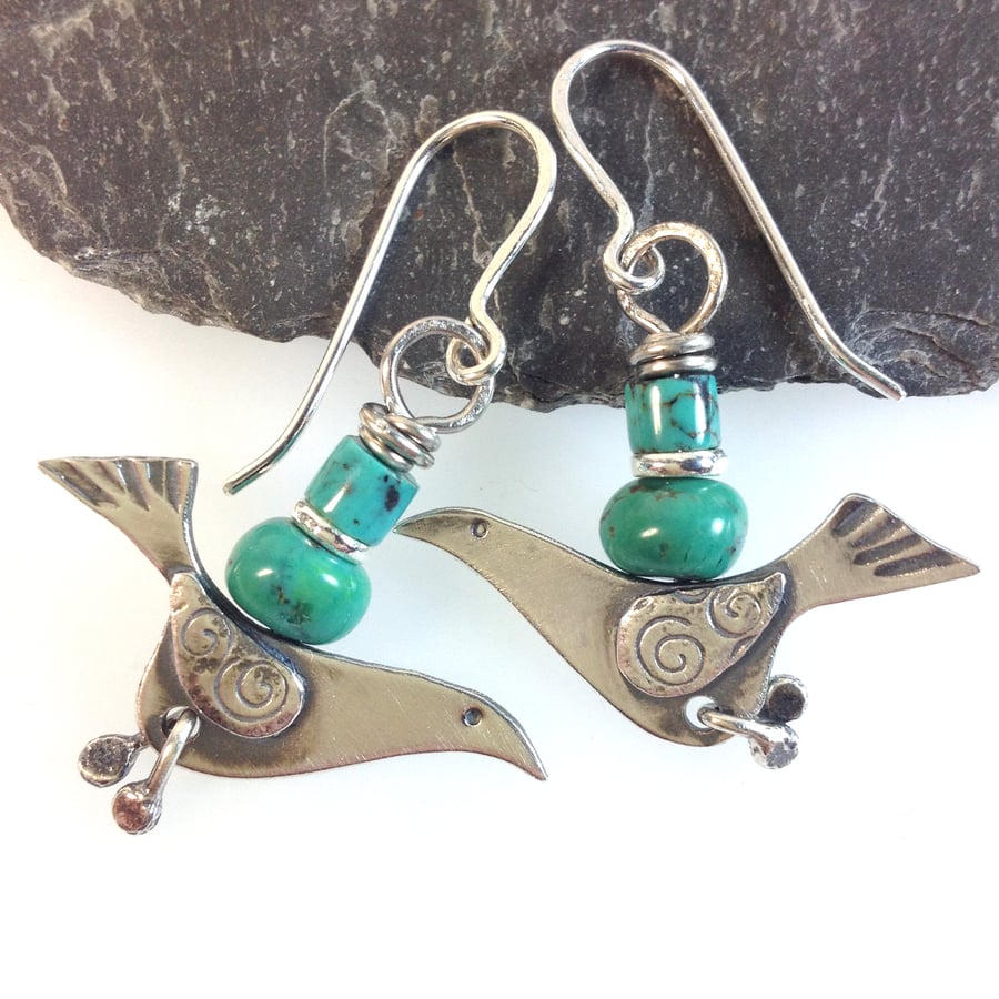 silver bird earrings with turquoise.