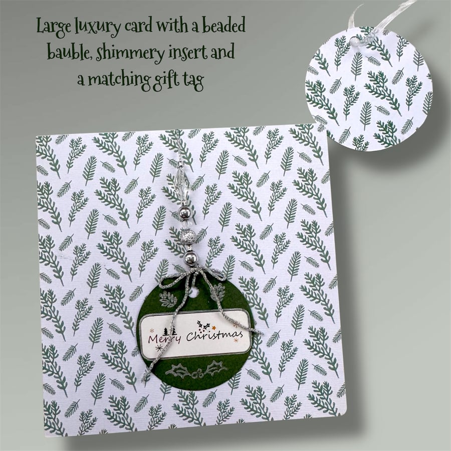Festive elegant Christmas card with bauble and beads 