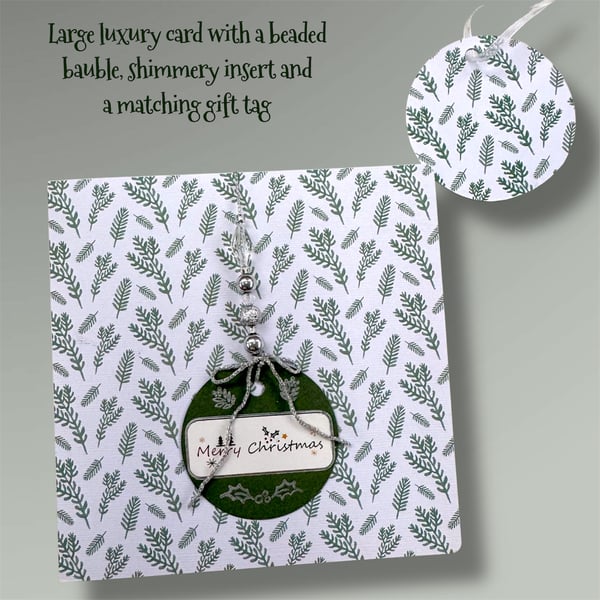 Festive elegant Christmas card with bauble and beads 