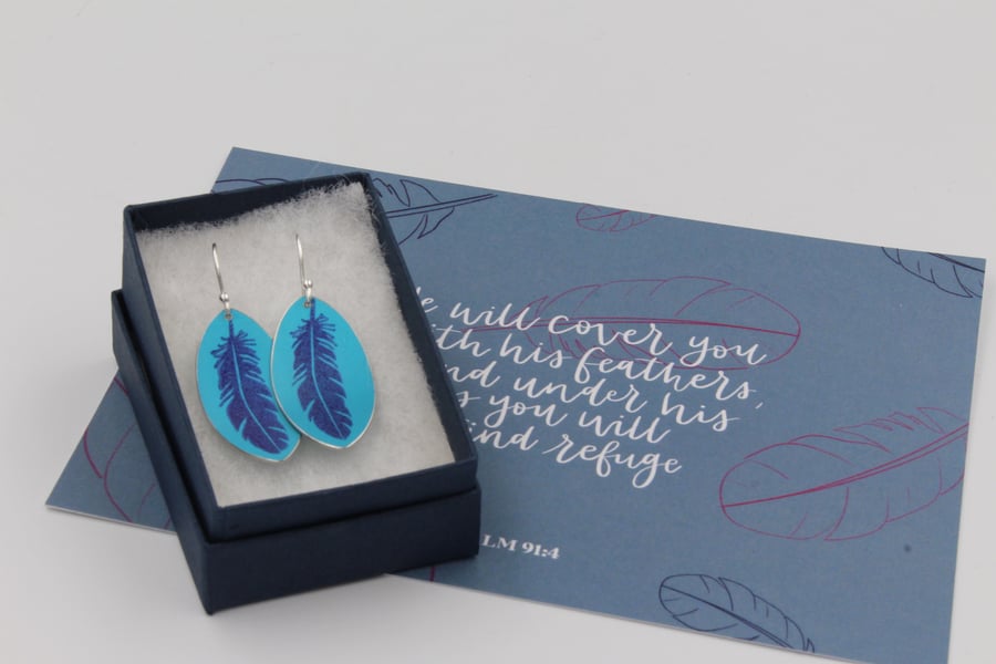 Anodised aluminium pink oval feather earrings and postcard set.