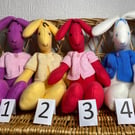 Soft Toy Bunny. Use WITHOUT Jacket for Newborn,  WITH Jacket for 36 months.