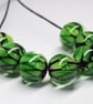 Handmade green snakeskin patterned lamp work glass beads - Image 3
