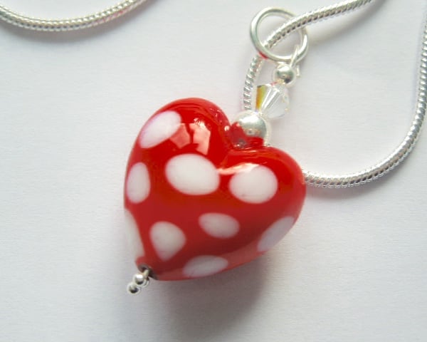 Red and white polka dot Murano glass heart pendant with sterling silver.