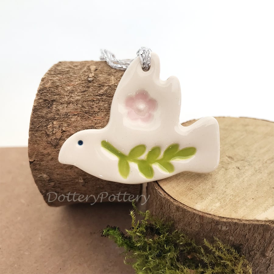 Teeny ceramic dove decoration with leaves and pale pink flower