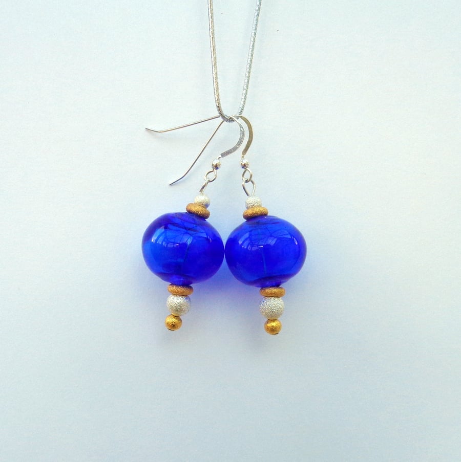 Lampwork glass bright blue hollow bauble earrings with metallic stardust beads