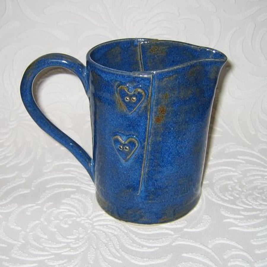 Jug with heart button detail