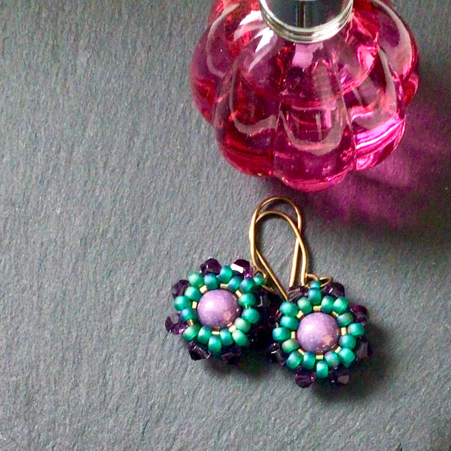 Beaded purple and green wheel earrings