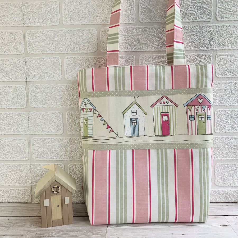 Pink striped tote bag with beach huts print panel