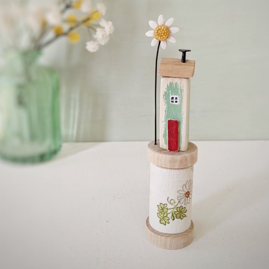Wooden House on a Floral Bobbin with Clay Daisy