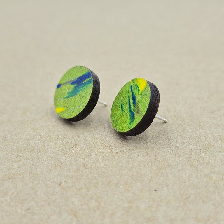Lime green stud earrings with dashes of navy blue, pink, green and yellow.